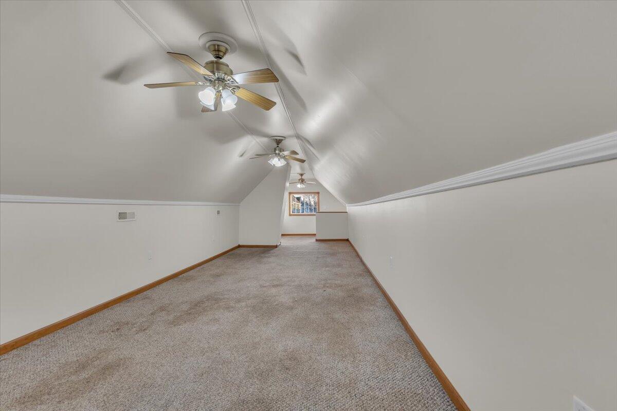1536 West Fred Street Whiting, IN 46394 - Photo 13 of 18 a view of a hallway with a chandelier fan