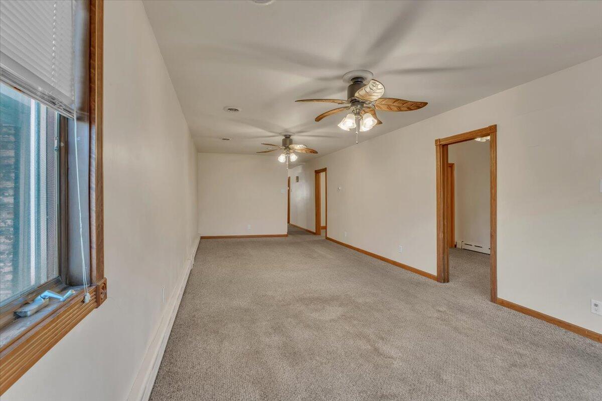 1536 West Fred Street Whiting, IN 46394 - Photo 4 of 18 a view of a livingroom with a ceiling fan and window