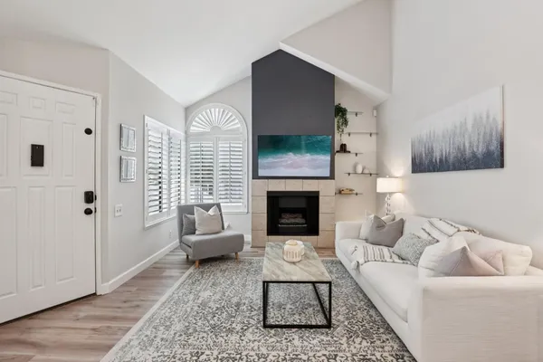 a living room with furniture and a fireplace