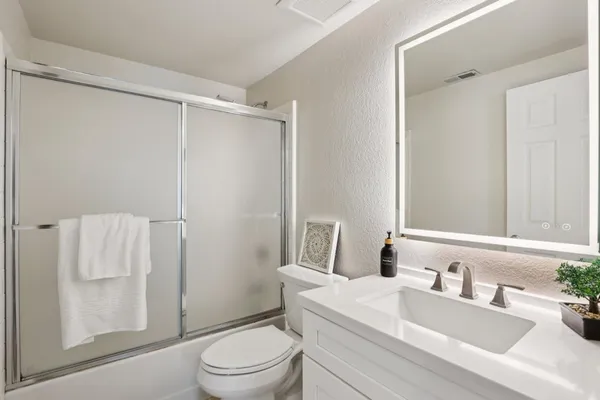 a view of a chair and table in the balcony