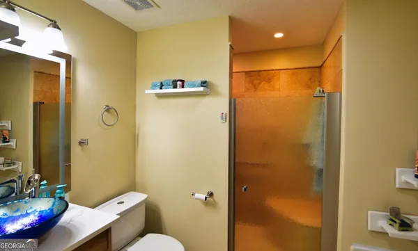 a bathroom with a shower and a tub