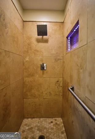 a view of a hallway with wooden floor and closet
