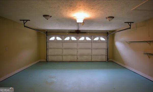 a view of backyard with deck and trees