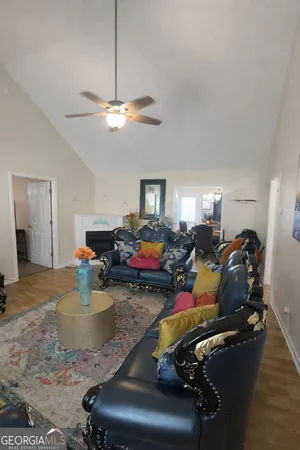 a bed room with furniture and a chandelier