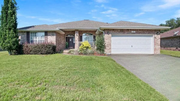 front view of a house with a yard
