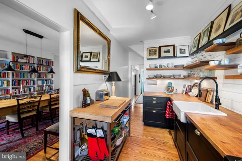 a kitchen with lots of counter top space and stove top oven