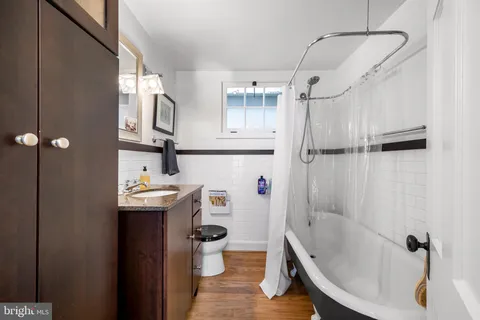 a bathroom with a sink a vanity and a shower