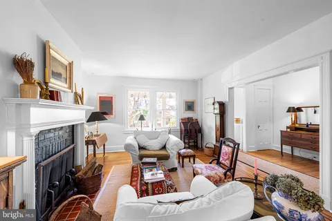 a living room with a large window and a table