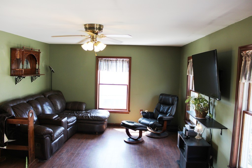 206 East Colrain Road Colrain, MA 01340 - Photo 16 of 27 a living room with furniture a window and a flat screen tv