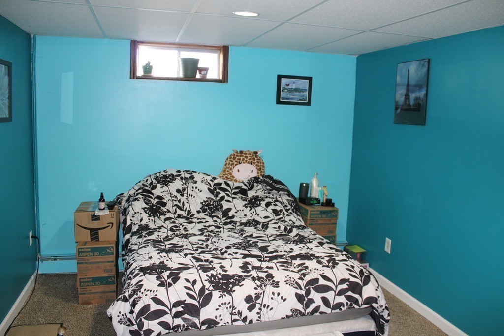 206 East Colrain Road Colrain, MA 01340 - Photo 19 of 27 a bed sitting in a bedroom next to a small yard