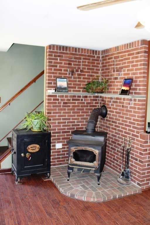 206 East Colrain Road Colrain, MA 01340 - Photo 8 of 27 a view of fireplace and wooden floor
