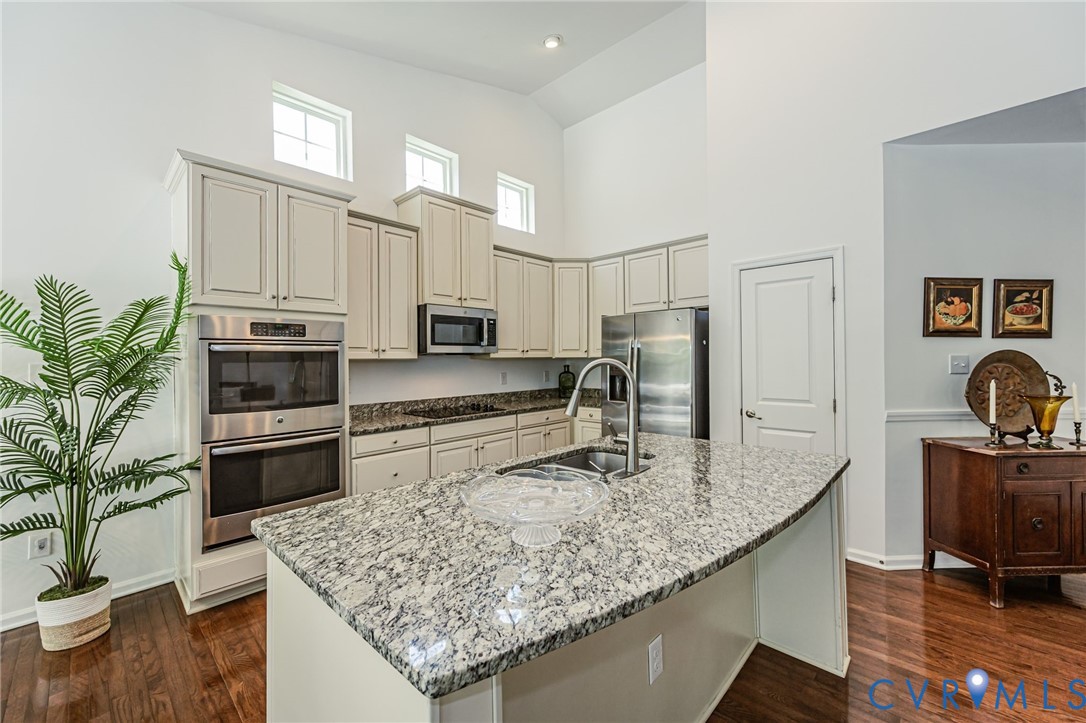 7435 Wicks Road Williamsburg, VA 23188 - Photo 28 of 82 Kitchen featuring a large island with an undermoun