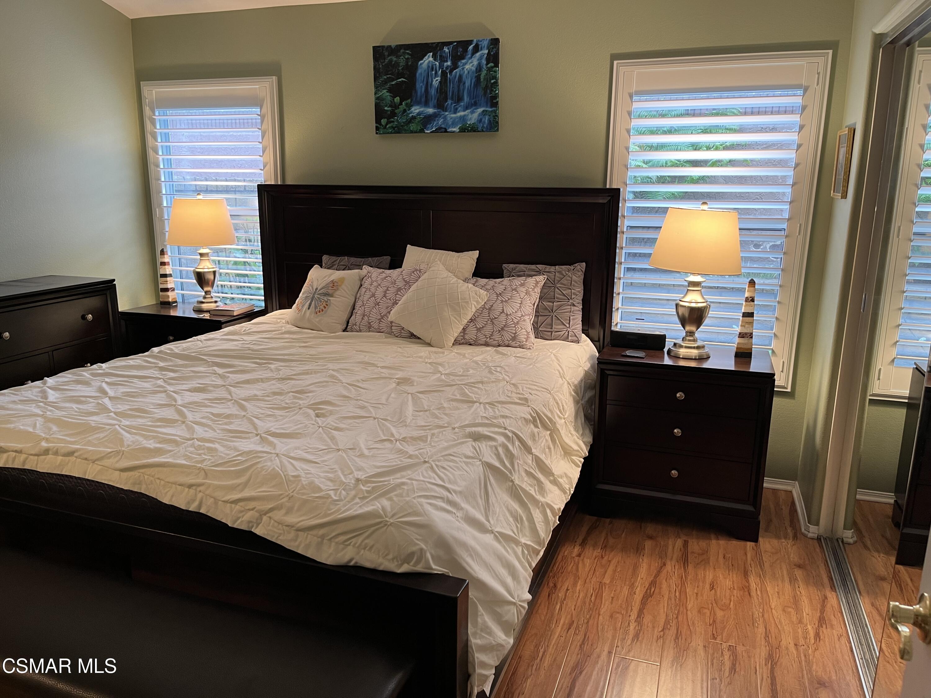 2040 Freesia Avenue Simi Valley, CA 93063 - Photo 11 of 23 a bedroom with a bed and wooden floor