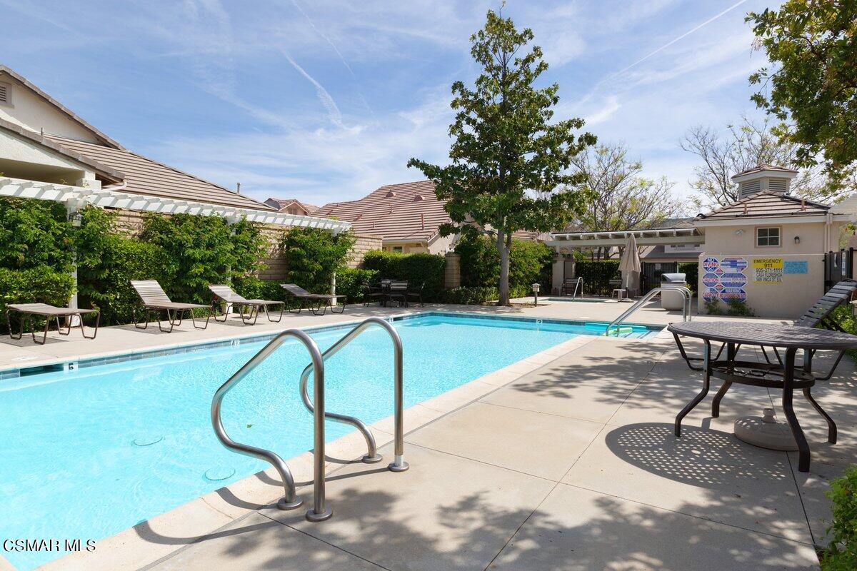 2040 Freesia Avenue Simi Valley, CA 93063 - Photo 23 of 23 a swimming pool with outdoor seating and yard