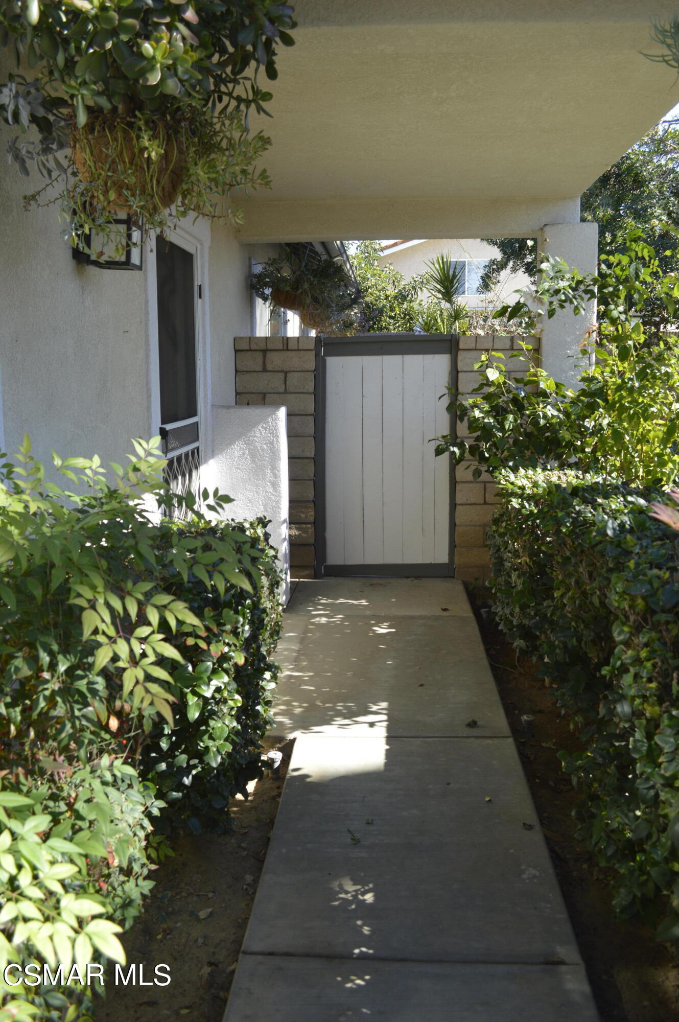2040 Freesia Avenue Simi Valley, CA 93063 - Photo 3 of 23 a view of a pathway along a garden