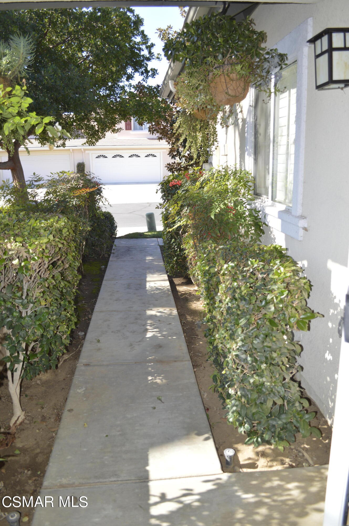 2040 Freesia Avenue Simi Valley, CA 93063 - Photo 4 of 23 a view of a pathway both side of house