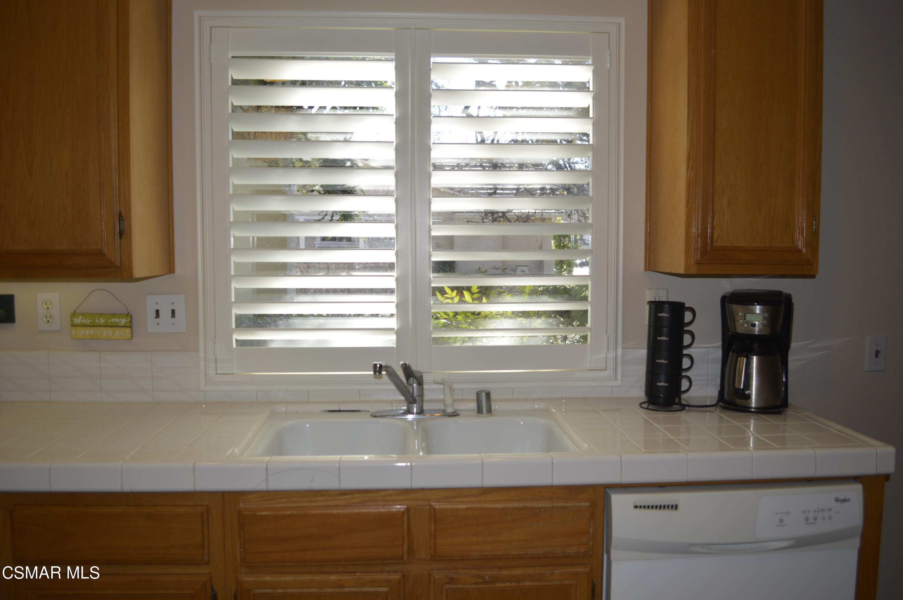 2040 Freesia Avenue Simi Valley, CA 93063 - Photo 9 of 23 a kitchen with granite countertop a sink and a window