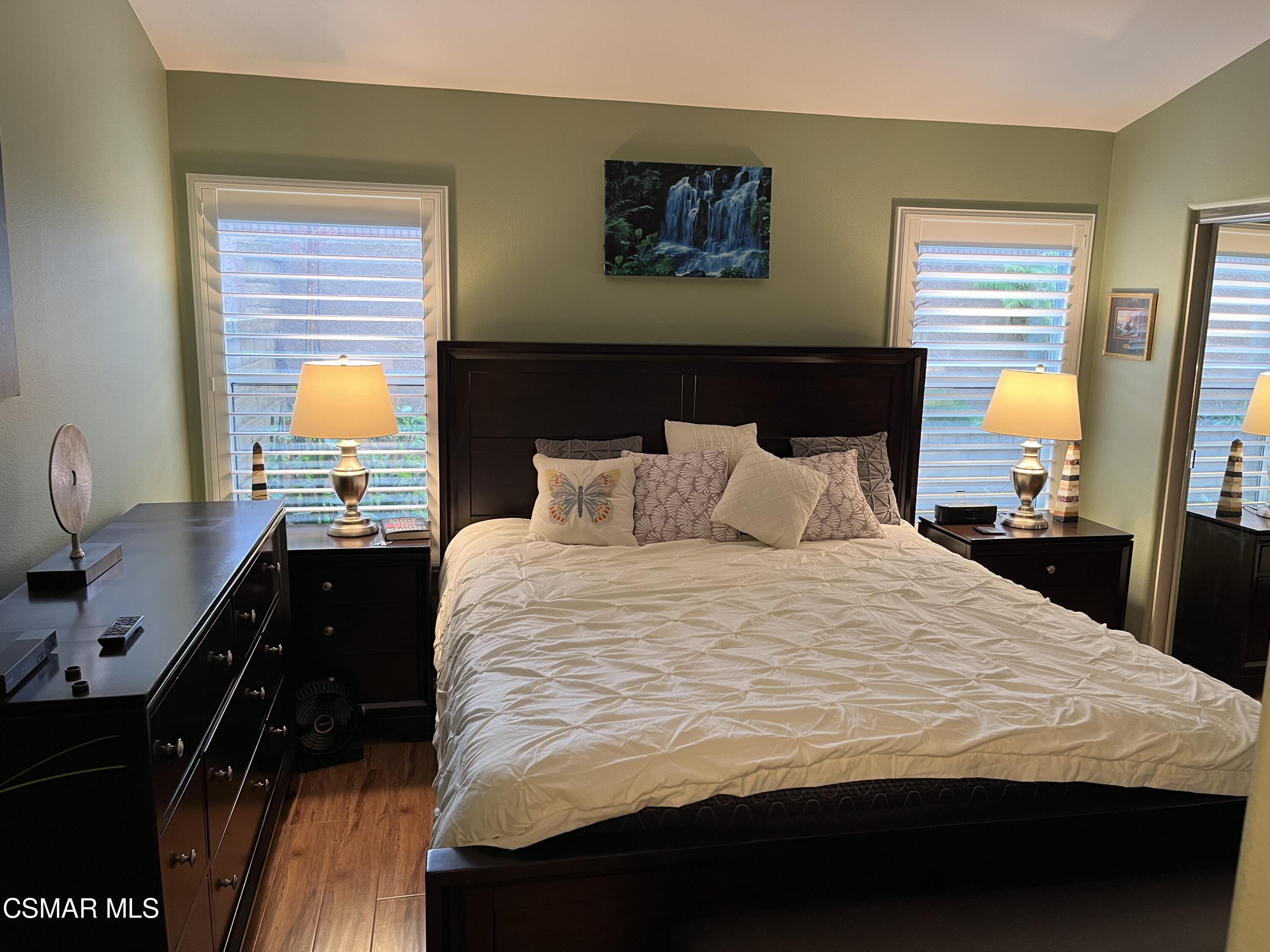 2040 Freesia Avenue Simi Valley, CA 93063 - Photo 10 of 23 a bedroom with a bed and wooden floor