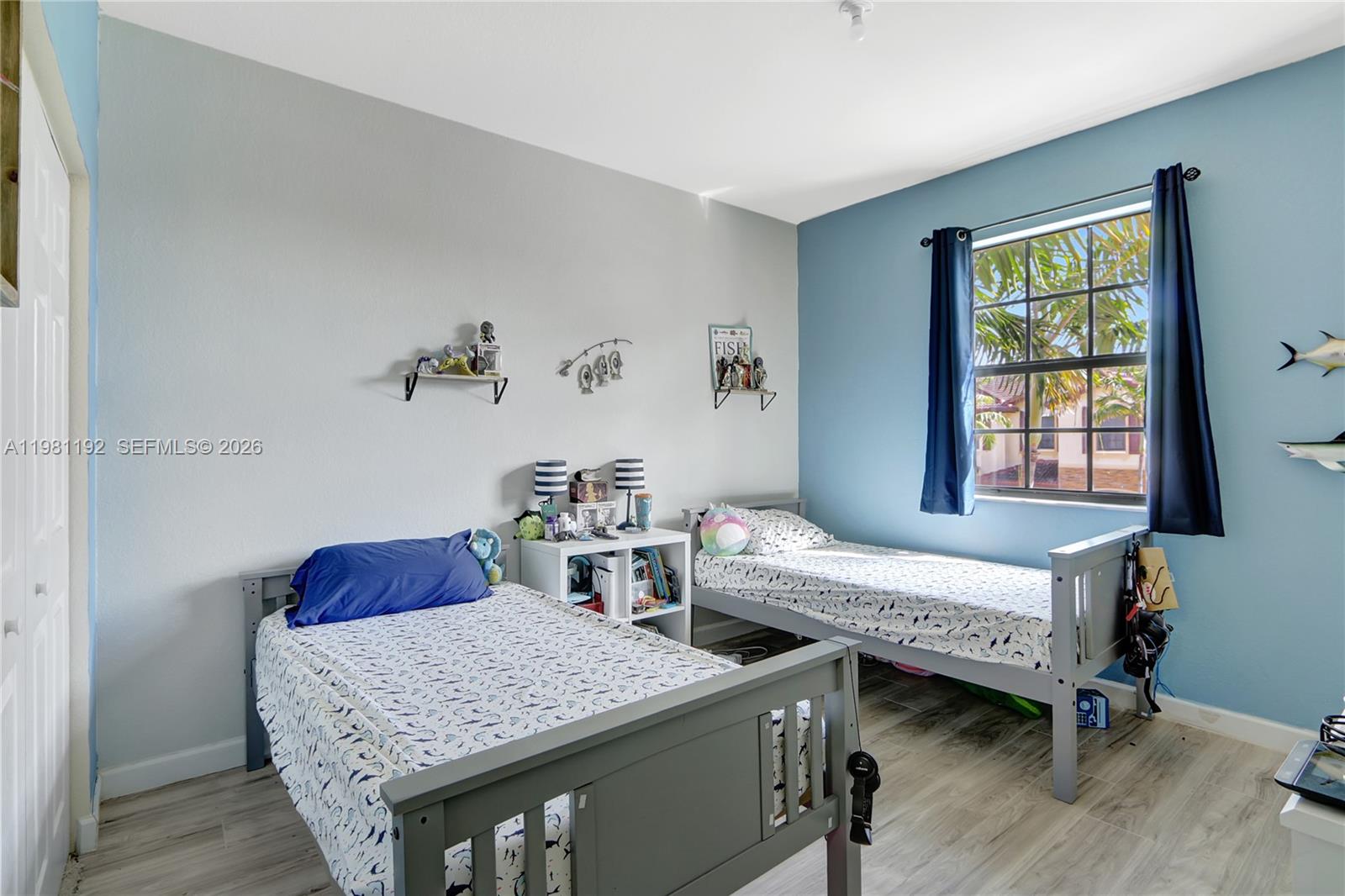 338 Northeast 37th Avenue Homestead, FL 33033 - Photo 16 of 19 a bedroom with two beds and a window