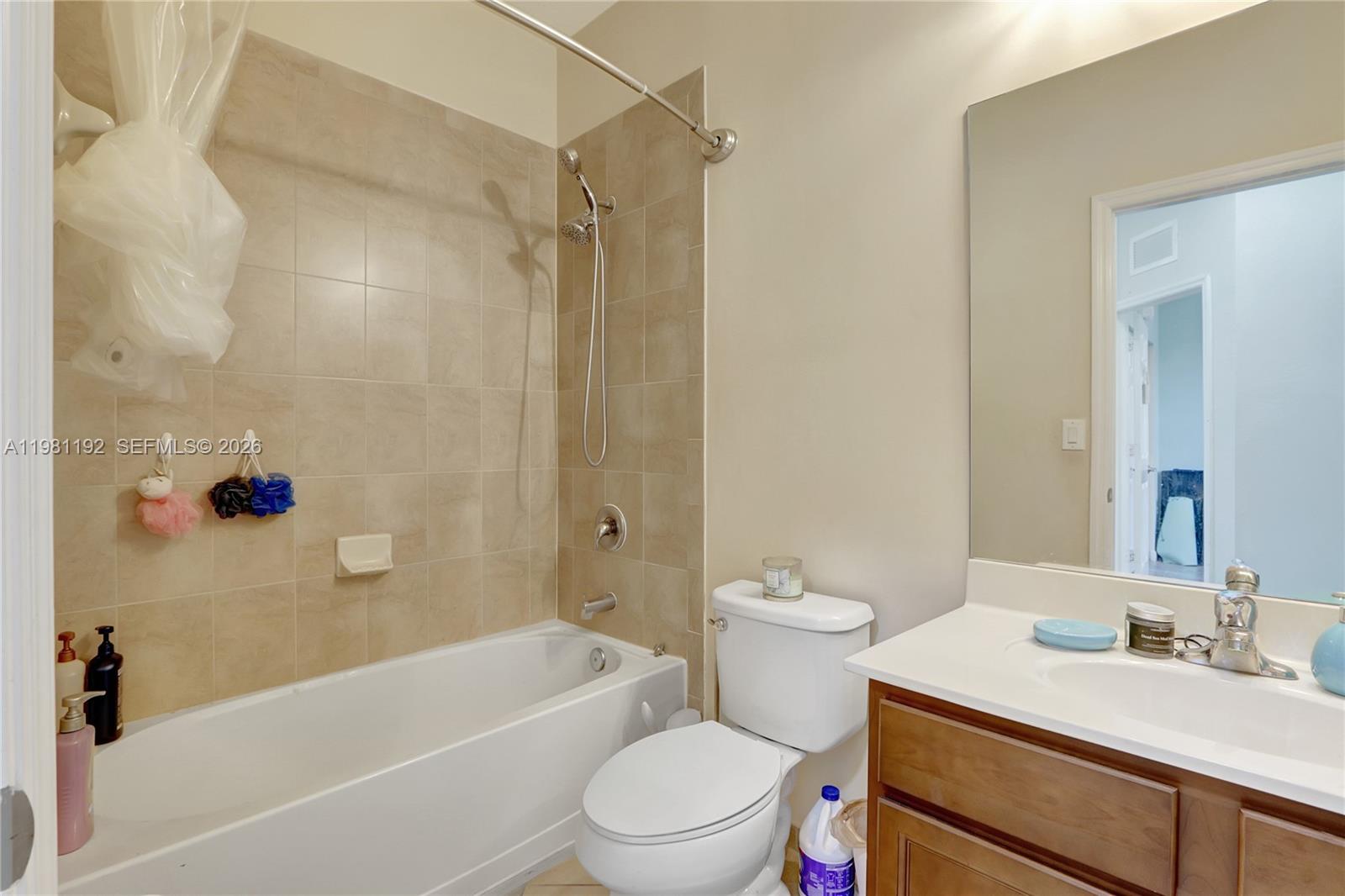 338 Northeast 37th Avenue Homestead, FL 33033 - Photo 17 of 19 a bathroom with a sink a toilet and a bathtub