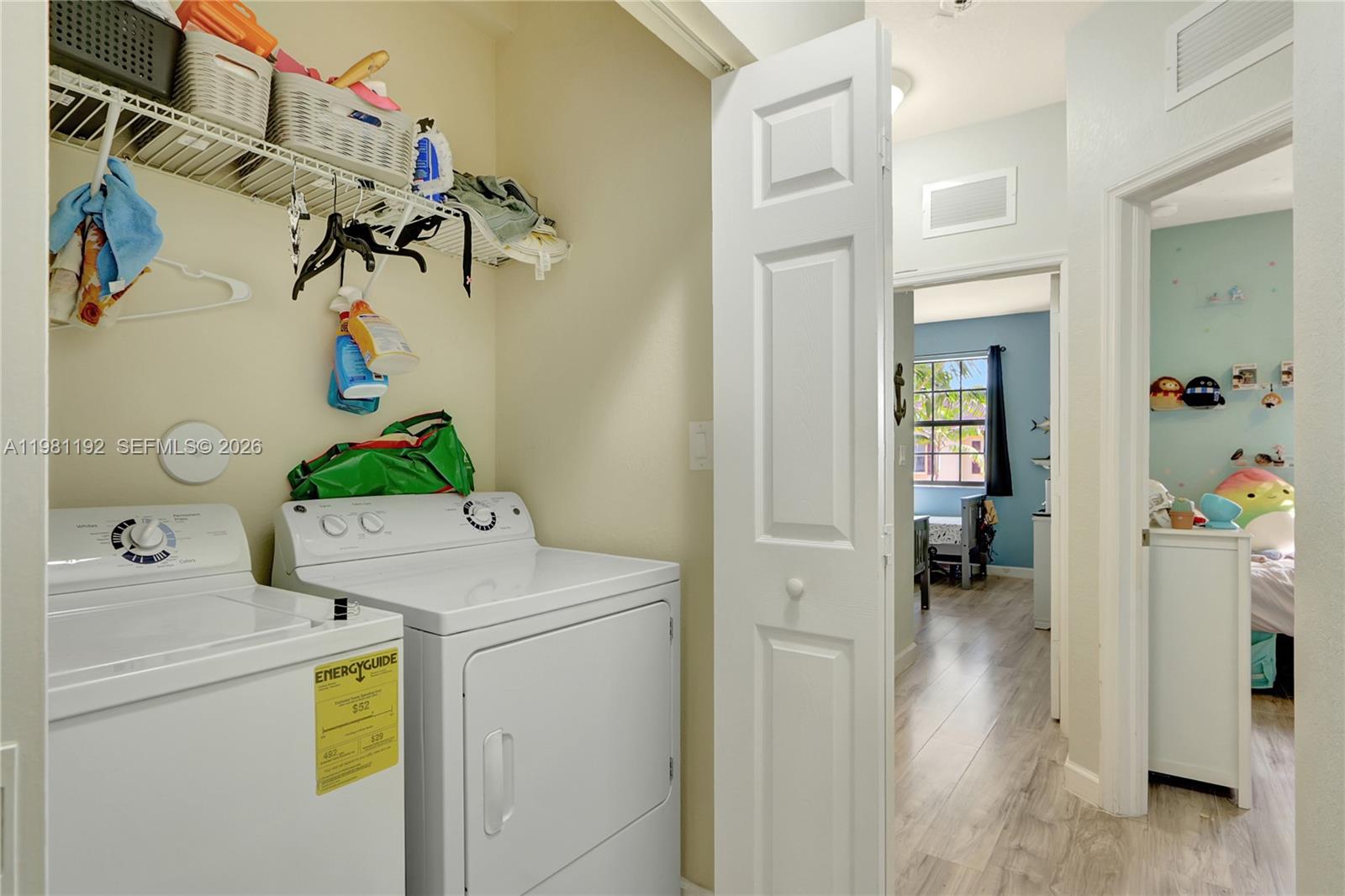 338 Northeast 37th Avenue Homestead, FL 33033 - Photo 18 of 19 a utility room with dryer and washer