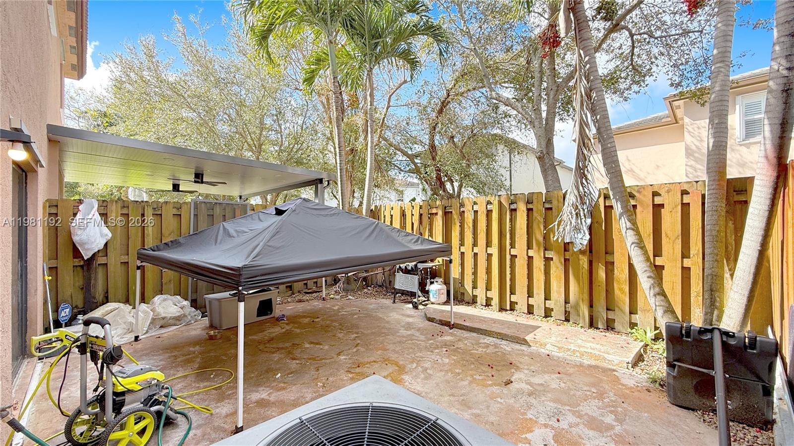 338 Northeast 37th Avenue Homestead, FL 33033 - Photo 19 of 19 a view of a dinning table and chairs in patio