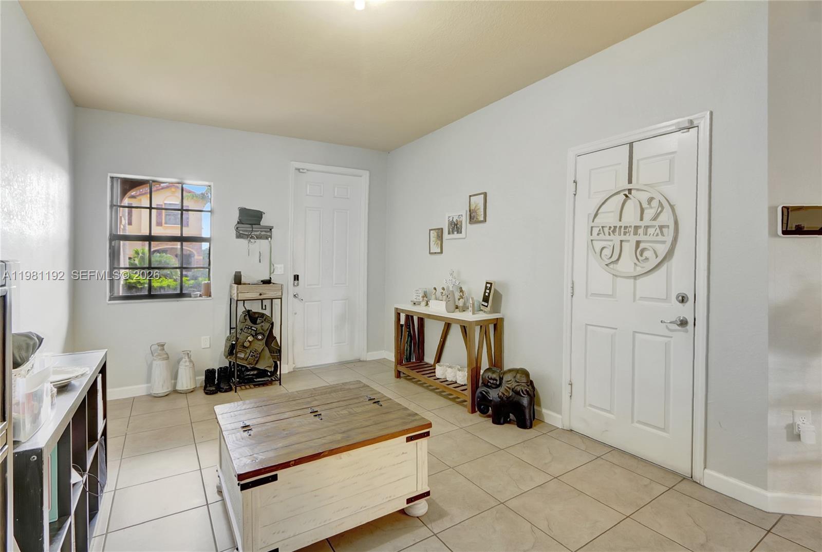338 Northeast 37th Avenue Homestead, FL 33033 - Photo 3 of 19 a view of a livingroom with furniture and windows