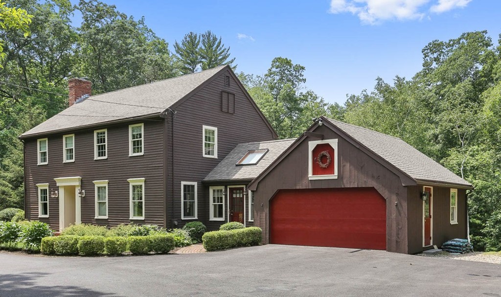 19 Bare Hill Road Boxford, MA 01921 - Photo 1 of 30 a front view of a house with a garden