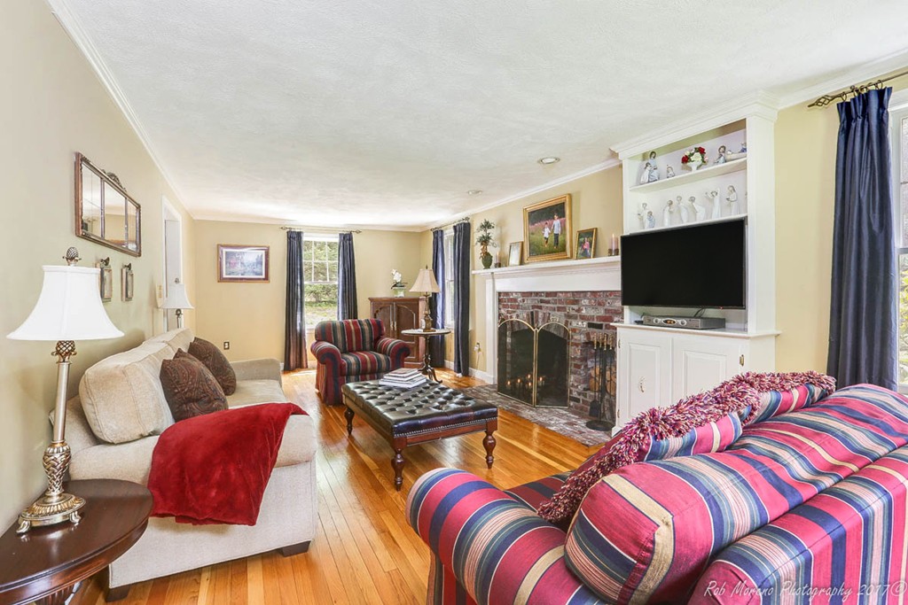 19 Bare Hill Road Boxford, MA 01921 - Photo 12 of 30 a living room with fireplace furniture and a flat screen tv