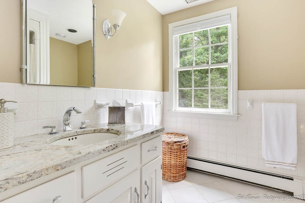 19 Bare Hill Road Boxford, MA 01921 - Photo 15 of 30 a bathroom with a granite countertop sink and a mirror
