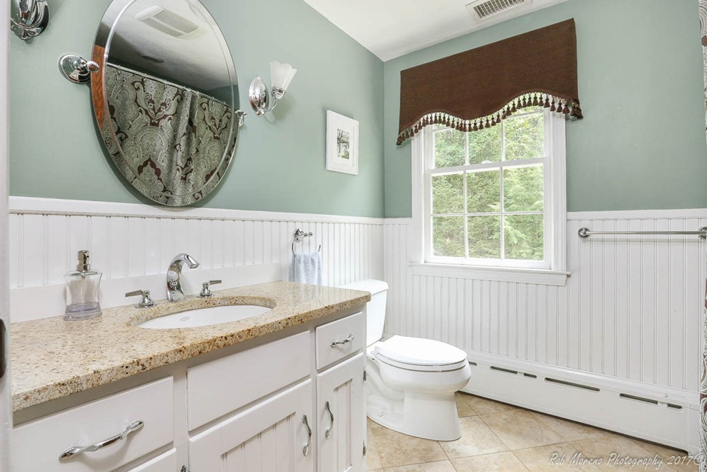 19 Bare Hill Road Boxford, MA 01921 - Photo 19 of 30 a bathroom with a granite countertop bathtub sink vanity mirror and toilet