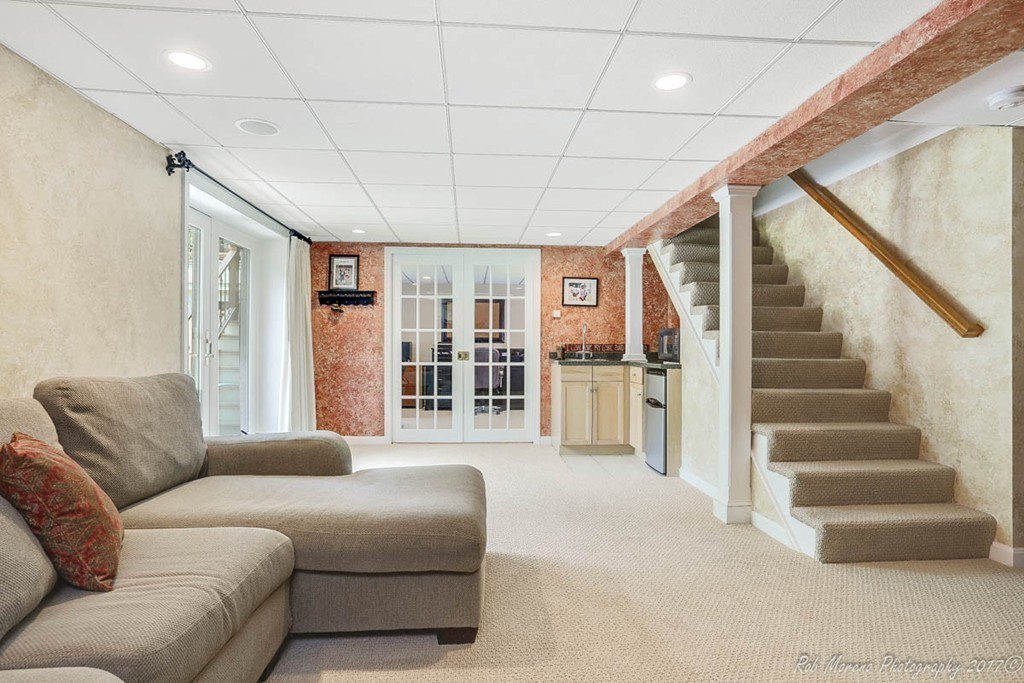 19 Bare Hill Road Boxford, MA 01921 - Photo 22 of 30 a living room with furniture a bookshelf and a large window