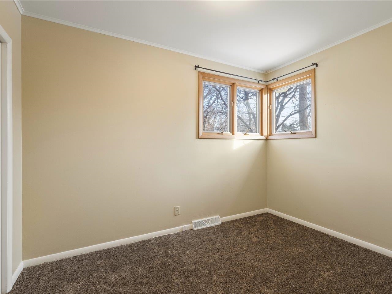 4701 Highcrest Road Rockford, IL 61107 - Photo 19 of 23 an empty room with a window