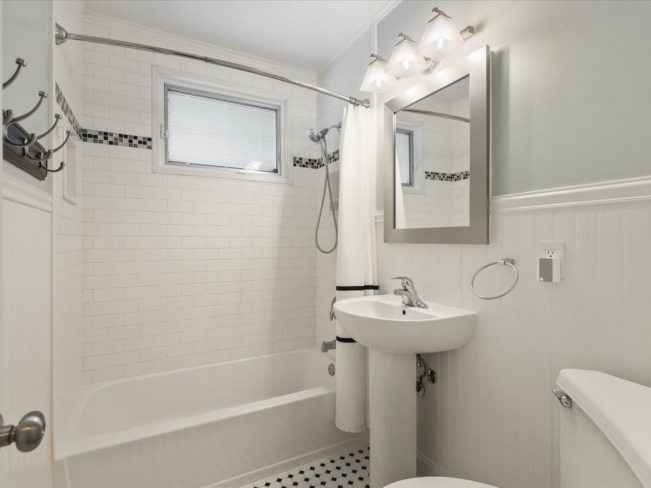 4701 Highcrest Road Rockford, IL 61107 - Photo 21 of 23 a bathroom with a sink a mirror and a shower