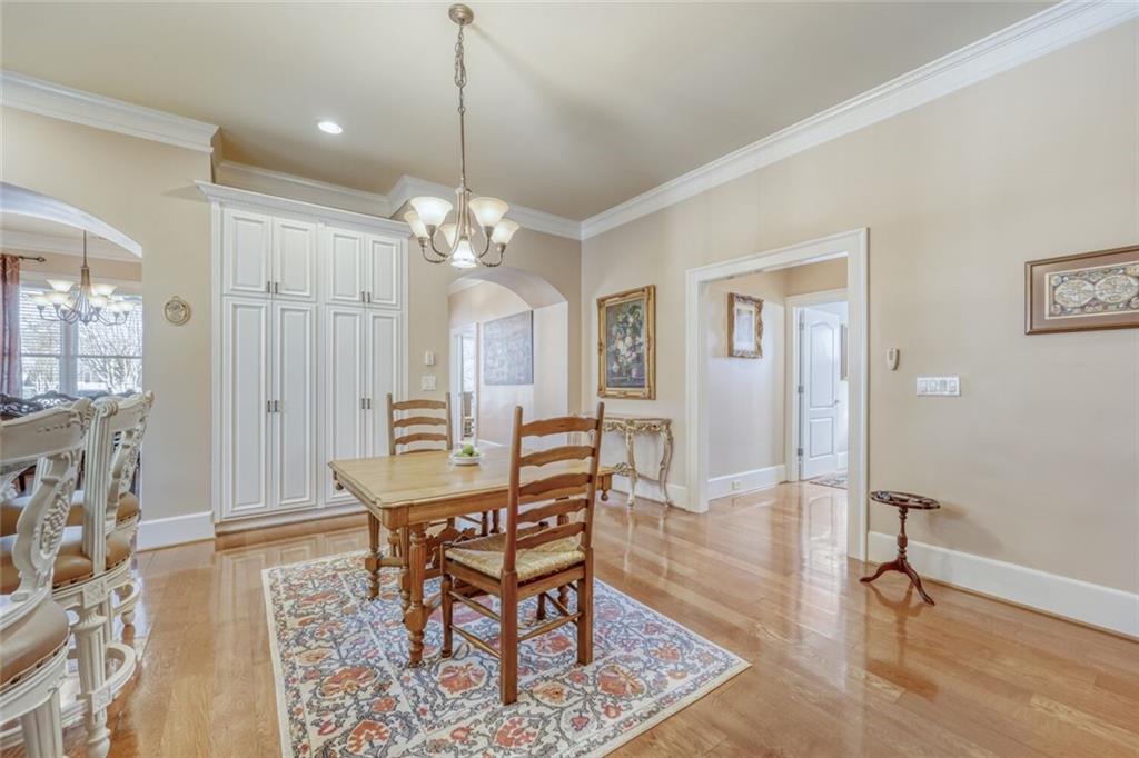 2380 Muskogee Lane Braselton, GA 30517 - Photo 16 of 30 a view of a a dining room with furniture window and wooden floor