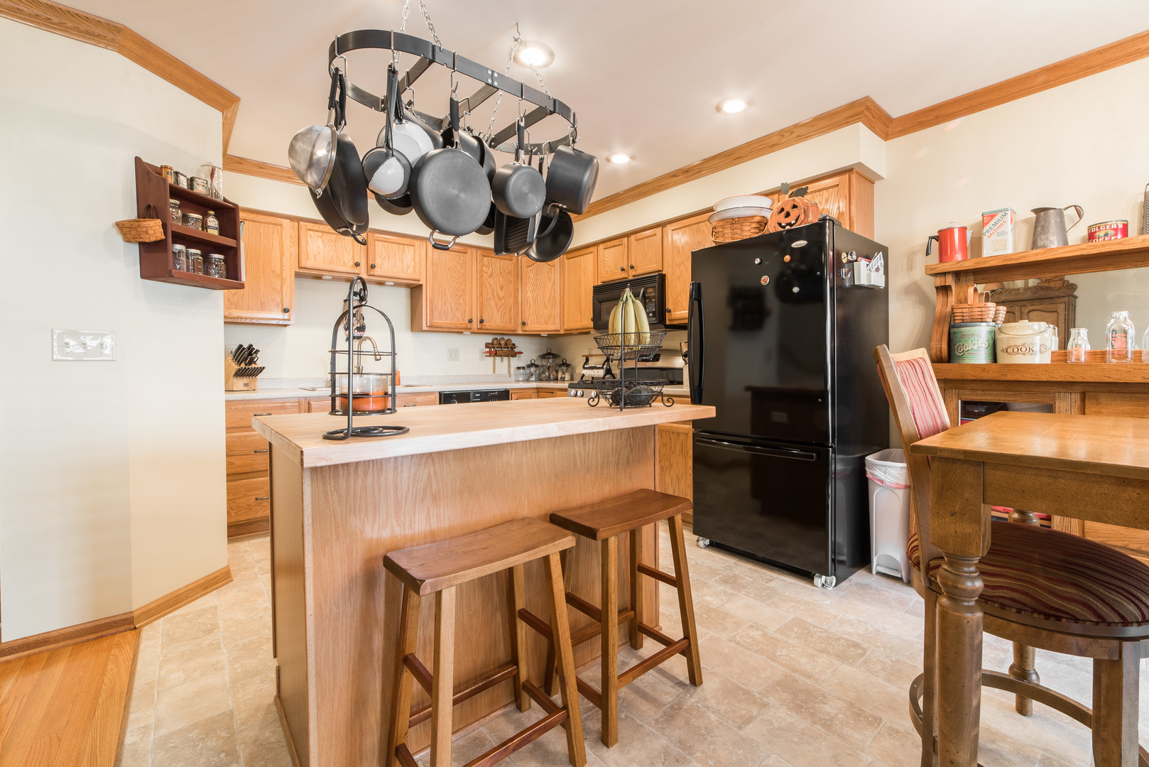 508 South Peace Road, Unit 508 Sycamore, IL 60178 - Photo 6 of 29 a kitchen with a sink a stove and chairs
