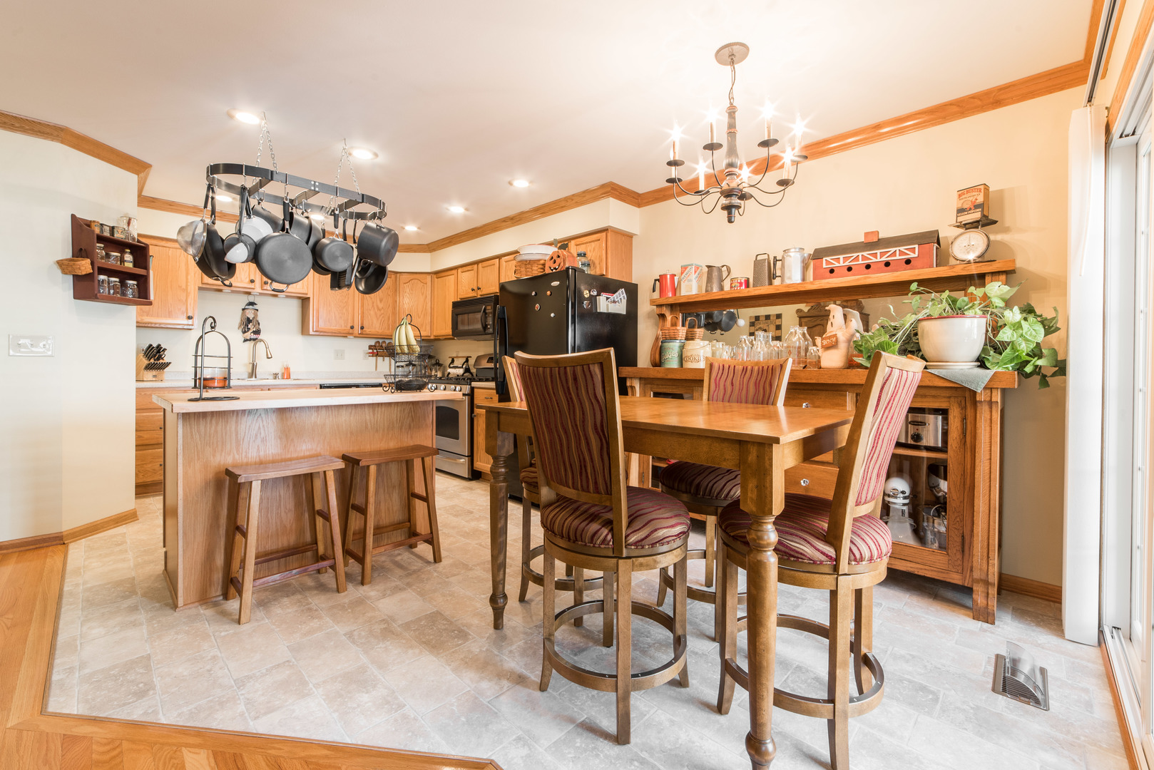 508 South Peace Road, Unit 508 Sycamore, IL 60178 - Photo 7 of 29 a view of a dining room with furniture and a chandelier