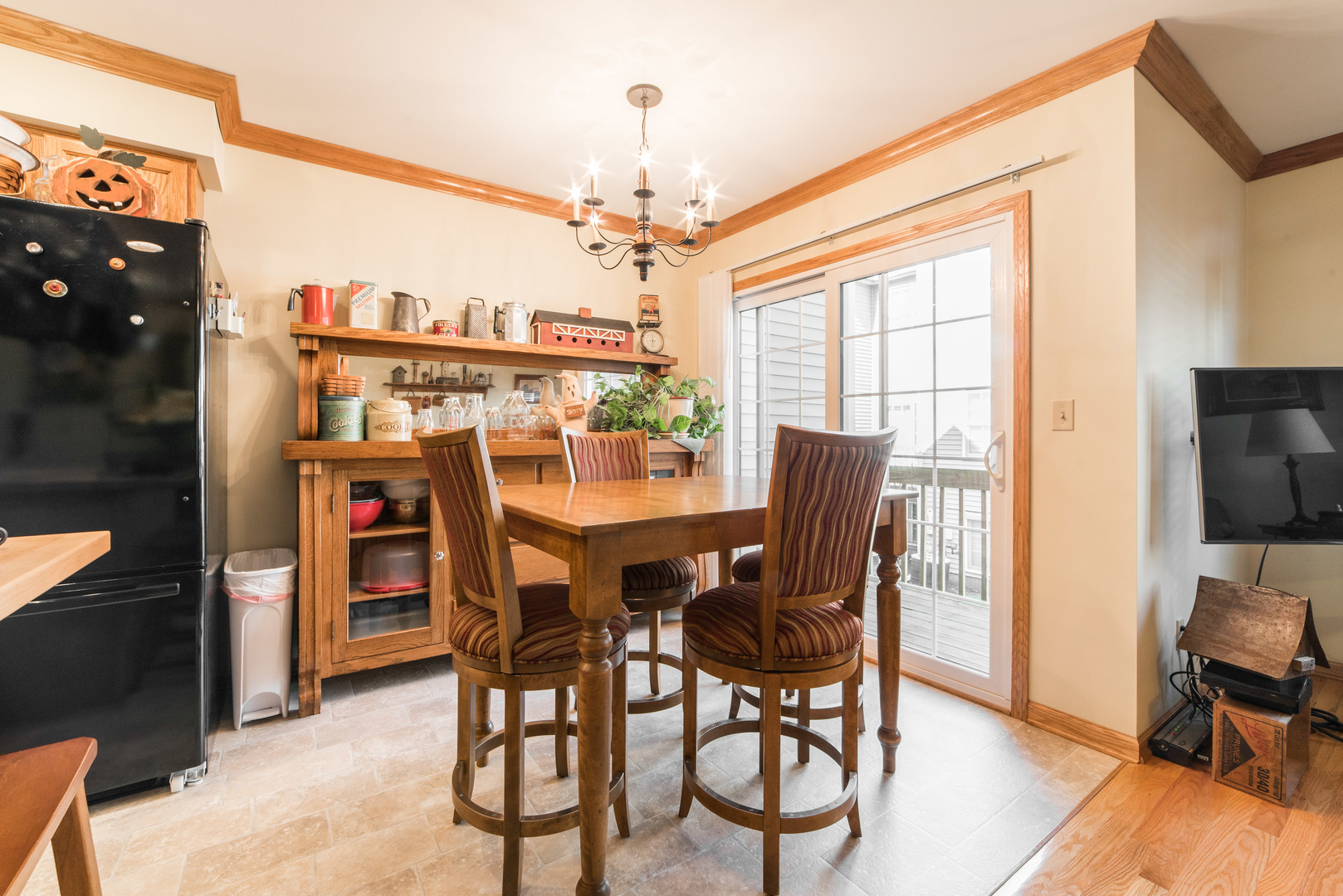 508 South Peace Road, Unit 508 Sycamore, IL 60178 - Photo 8 of 29 a dining room with furniture a chandelier and wooden floor