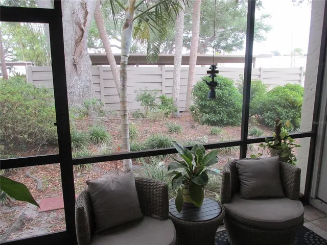 a view of balcony with furniture