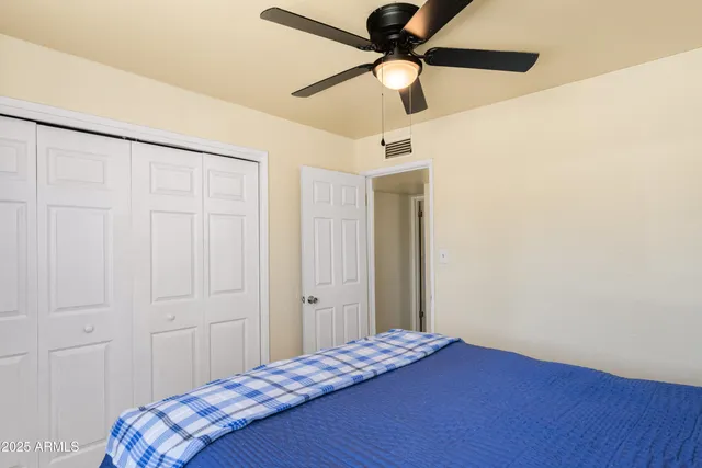 a white toilet sitting next to a bathroom sink
