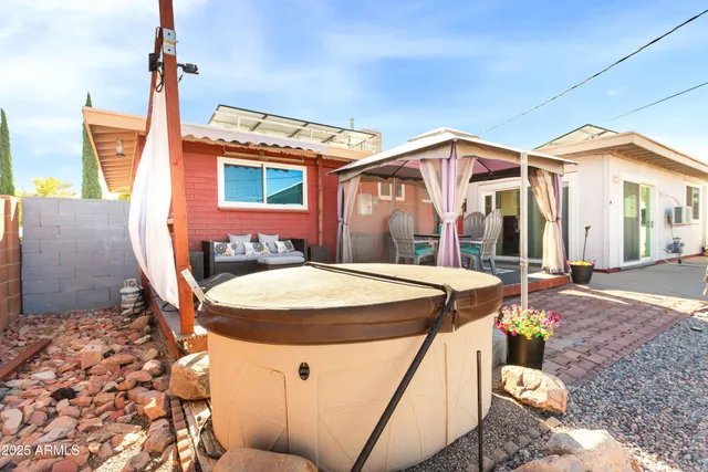 a table and chairs in front of a door