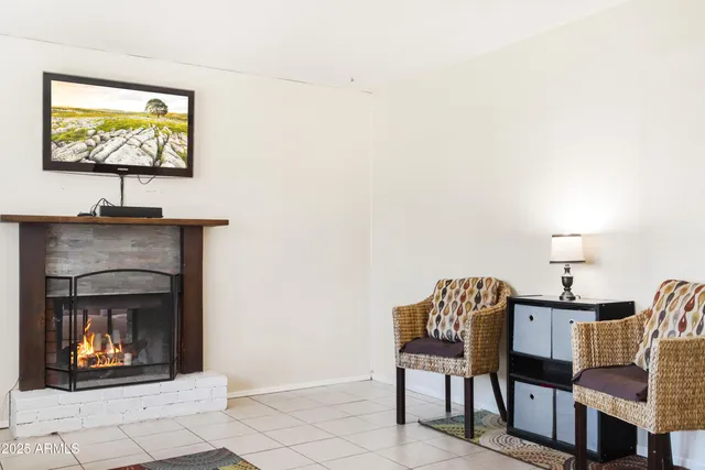 a living room with furniture and a chair