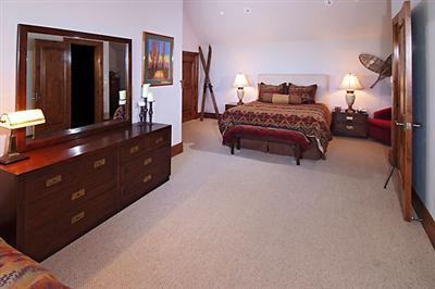 2509 Daybreak Ridge Road Avon, CO 81620 - Photo 9 of 19 a spacious bedroom with a bed and window