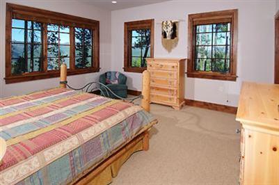 2509 Daybreak Ridge Road Avon, CO 81620 - Photo 10 of 19 a bedroom with a bed and wooden floor