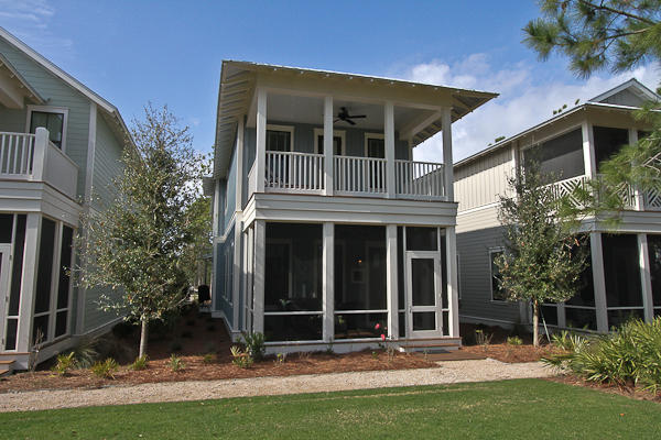 a view of house with yard in front of it
