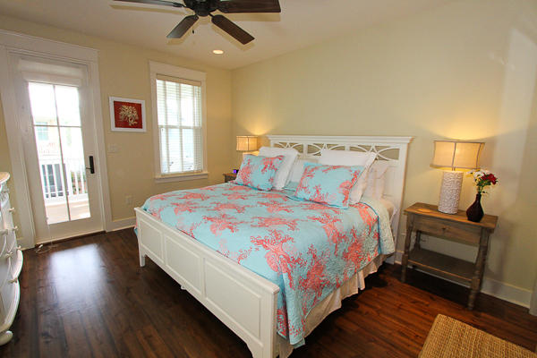 17 Red Basil Drive Santa Rosa Beach, FL 32459 - Photo 11 of 20 a bedroom with a bed and wooden floor