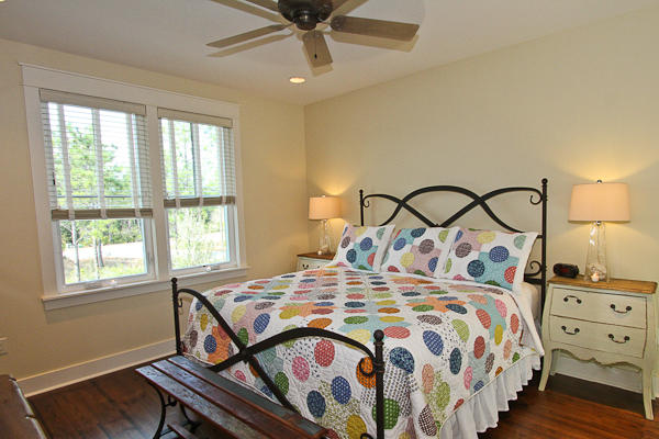 17 Red Basil Drive Santa Rosa Beach, FL 32459 - Photo 13 of 20 a bedroom with a bed a dresser and windows