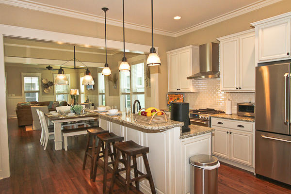17 Red Basil Drive Santa Rosa Beach, FL 32459 - Photo 6 of 20 a kitchen with stainless steel appliances a dining table chairs stove refrigerator and cabinets