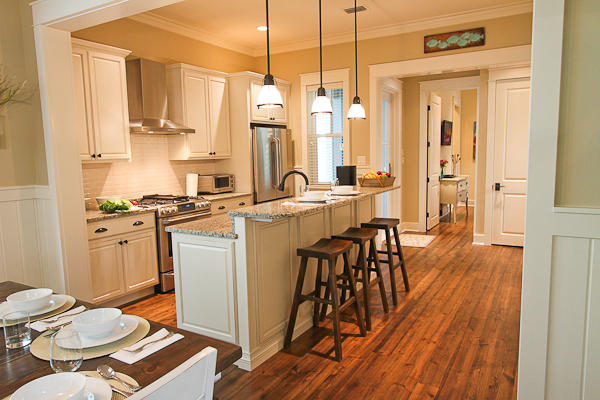 17 Red Basil Drive Santa Rosa Beach, FL 32459 - Photo 7 of 20 a kitchen with stainless steel appliances a dining table chairs stove and sink