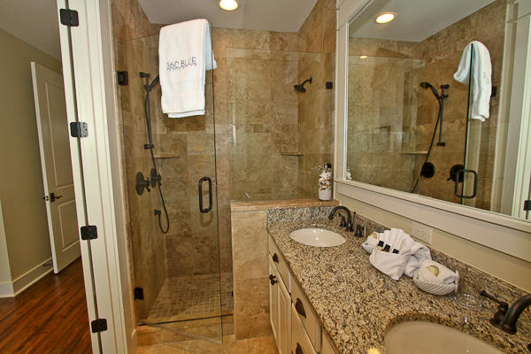 17 Red Basil Drive Santa Rosa Beach, FL 32459 - Photo 9 of 20 a bathroom with a granite countertop shower mirror and a sink